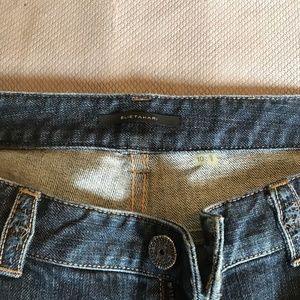 Elie Tahari boot-cut jeans.